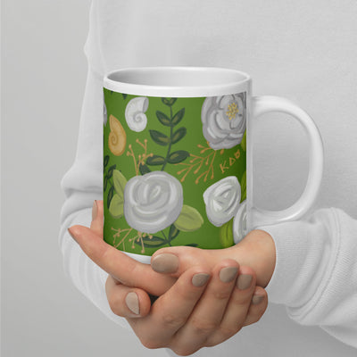 Kappa Delta Sorority Mug in green floral print shown on 20 oz mug in model's hands