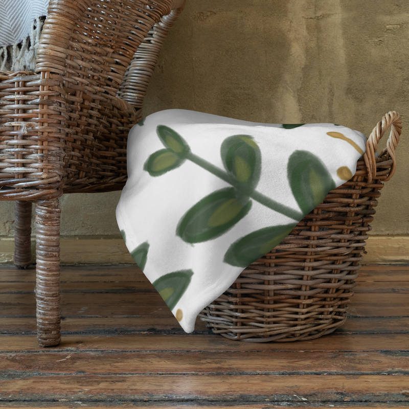 Kappa Delta throw blanket with rose floral print shown in basket