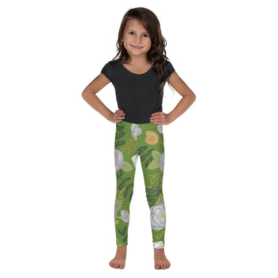 Child wearing a black top and green floral print Kappa Delta kid's leggings