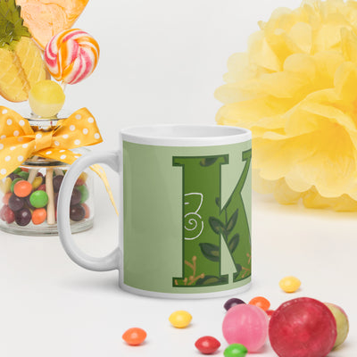 Kappa Delta Letters Mug shown in light green in lifestyle setting 