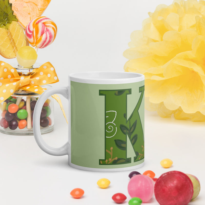 Kappa Delta Letters Mug shown in light green in lifestyle setting 