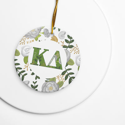 kappa delta holiday ornament shown on white background featuring kd filled letters and rose floral print accent