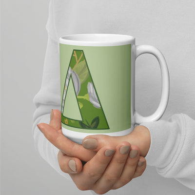 Kappa Delta Letters Mug shown in model's hands in light green in 15 oz size
