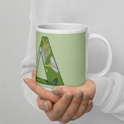 Kappa Delta Letters Mug in 20 oz size in model's hands in light green