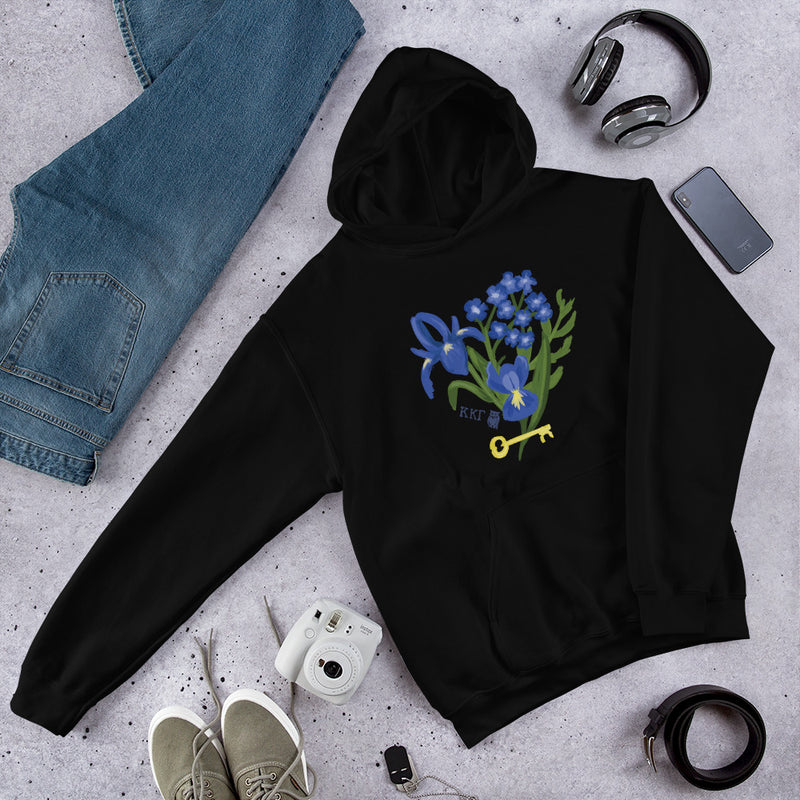 Kappa Kappa Gamma Fleur de Key Hoodie shown laying flat in black in lifestyle setting