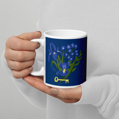 Kappa Kappa Gamma Fleur de Key Mug in Navy blue shown in model's hands in 11 oz size