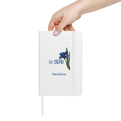 Kappa Kappa Gamma 1870 Journal in white shown in woman's hand