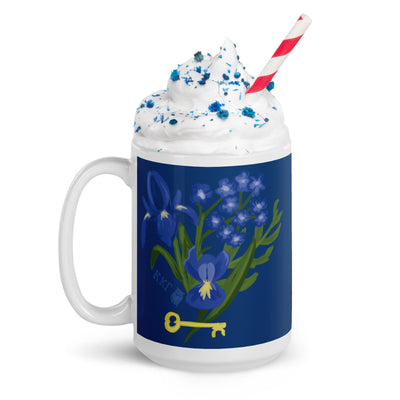 Kappa Kappa Gamma Fleur de Key Mug in Navy blue shown in model's hands in 15 oz size with handle on left