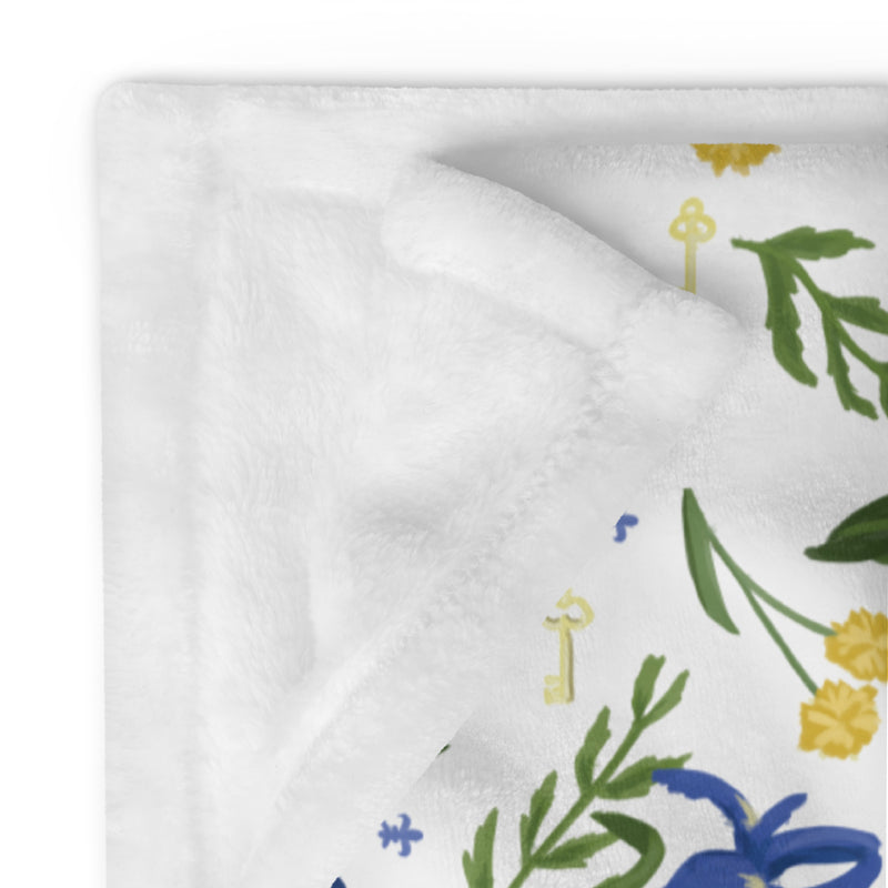 kappa kappa gamma sorority throw blanket with fleur de lis floral print showing white reverse side