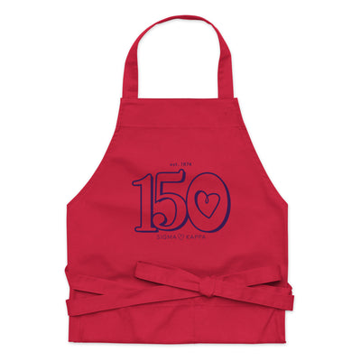 Sig Kap 150th Anniversary Organic Cotton Apron in red in close up view