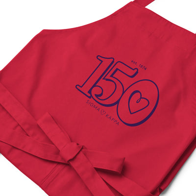 Sig Kap 150th Anniversary Organic Cotton Apron in red in detail view