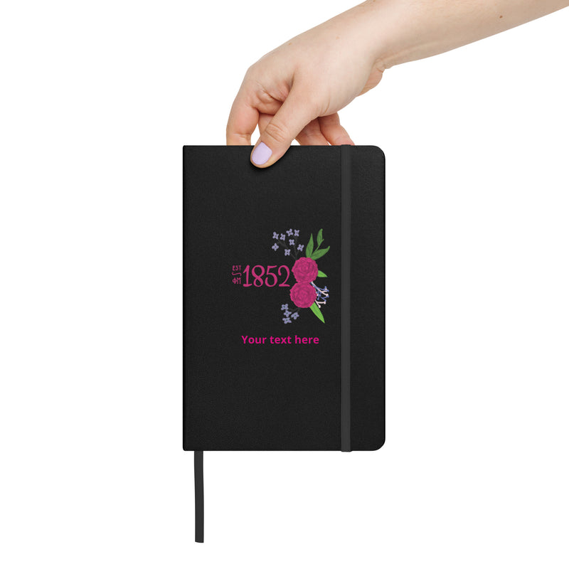 Phi Mu 1852 Personalized Journal Notebook in black shown in woman&