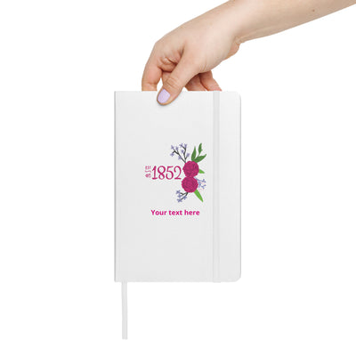 Phi Mu 1852 Personalized Journal in white shown in model's hand