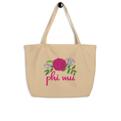 Phi Mu Carnation Tote Bag in natural oyster color shown hanging on a hook