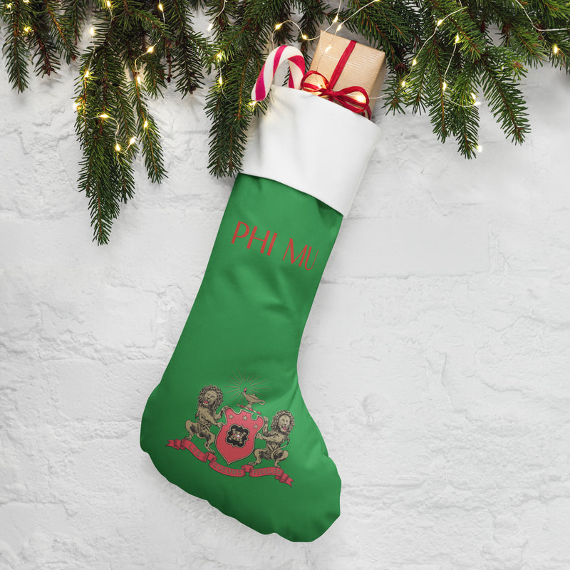 Phi Mu Coat of Arms Holiday Stocking with pine branches and lights