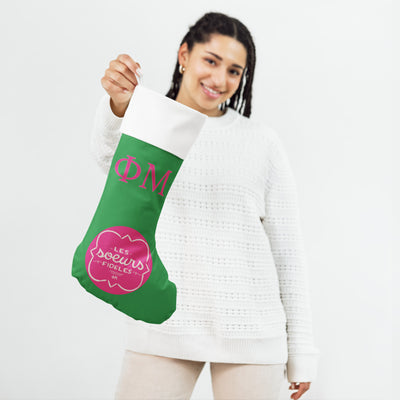 Phi Mu Les Soeurs Holiday Stocking in model's hand