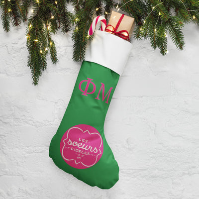 Phi Mu Les Soeurs Holiday Stocking with pine branches and lights