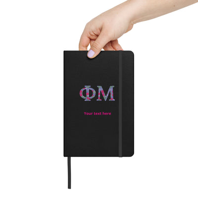 A personalized Phi Mu Journal book with a black cover, featuring the Phi Mu Greek letters and a placeholder for custom text.