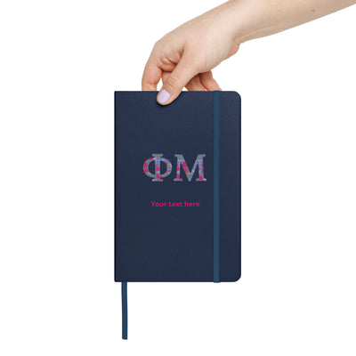 phi mu letters sorority journal in navy blue in model's hand