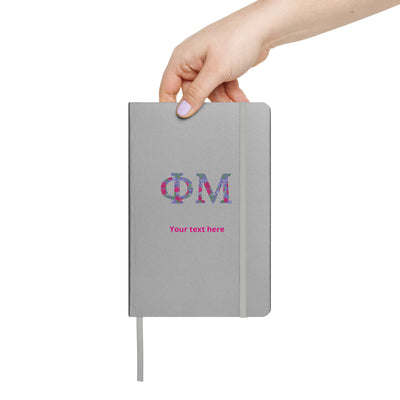 phi mu sorority letters journal in silver shown in model's hand