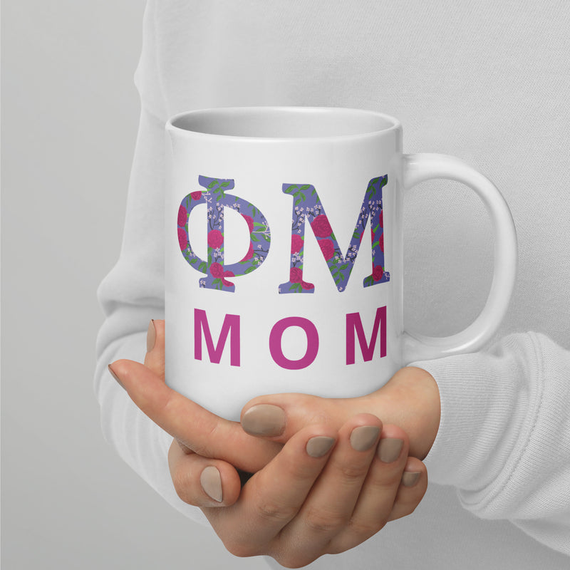 Phi Mu Mom Mug in 20 oz size showing filled letter design in model&