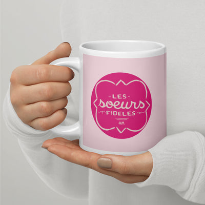 Phi Mu Motto Mug in 20 oz size shown in model's hands