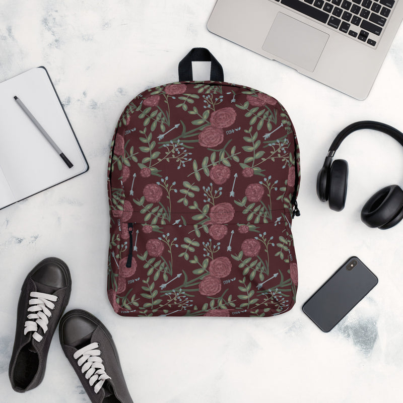 Pi Beta Phi Carnation Floral Print Backpack shown in lifestyle setting in wine color