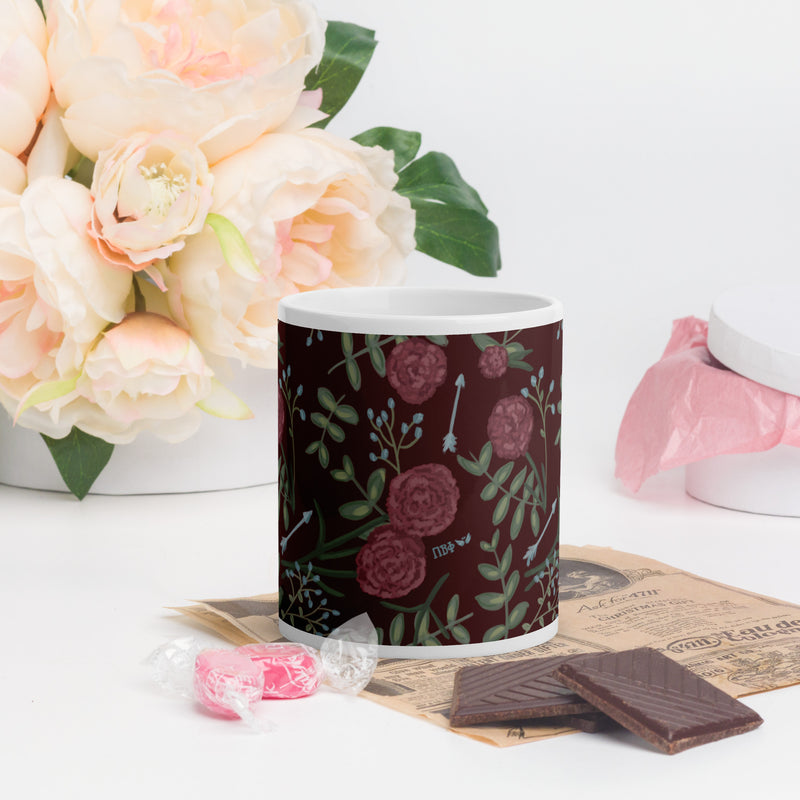 Pi Beta Phi carnation print mug in 11 oz size shown in lifestyle setting