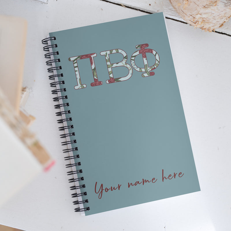 Pi Beta Phi Filled Letters Notebook in silvery blue with filled letters in a carnation floral print showing personalization