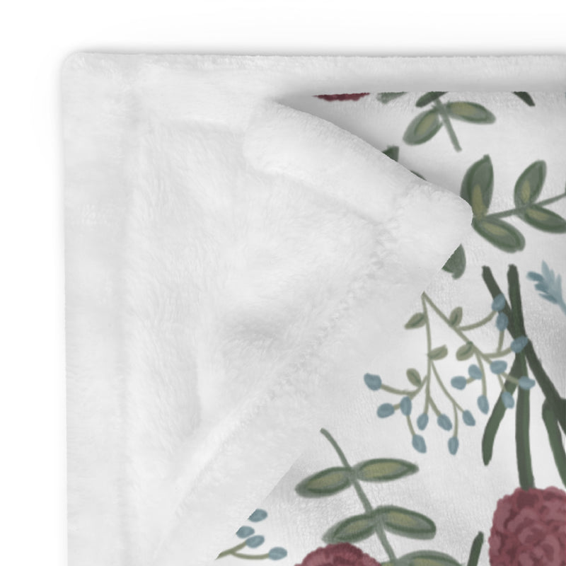 Pi Beta Phi floral throw blanket in white showing white reverse side