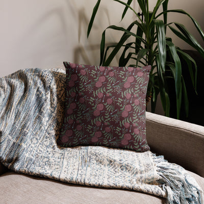 Pi Beta Phi 1867 pillow showing reverse side with carnation floral print in wine on back shown on couch