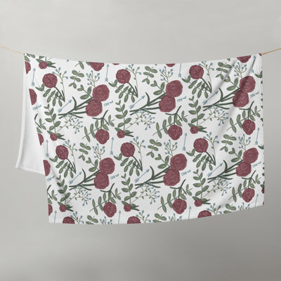 Pi Beta Phi floral throw blanket in white in 50" x 60" size shown hanging on clothesline