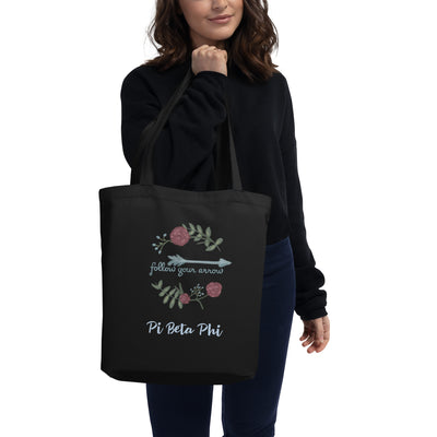 Pi Beta Phi Follow Your Arrow Tote Bag in black shown on model's arm