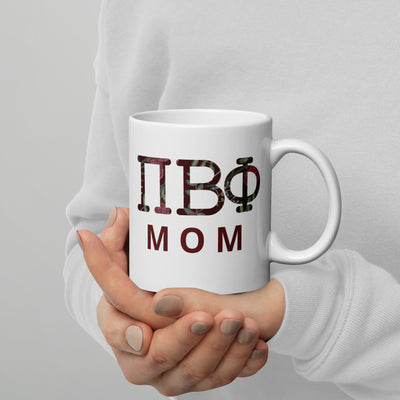 Pi Beta Phi Mom Mug with filled letters and handle on right shown in model's hands