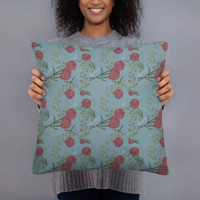 Pi Beta Phi carnation floral print pillow in model's hands in silvery blue color