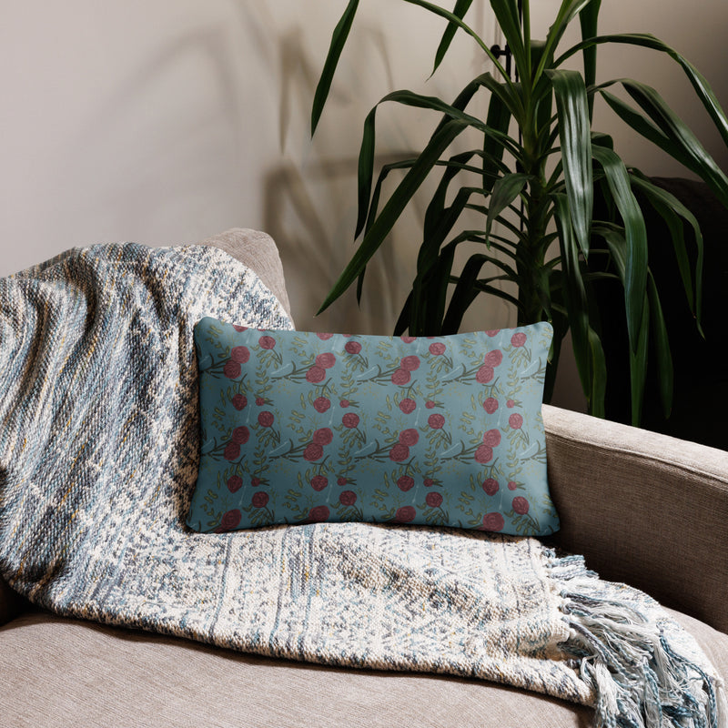 Pi Beta Phi carnation floral print pillow in 20" x 12" lumbar pillow size shown on couch in silvery blue color