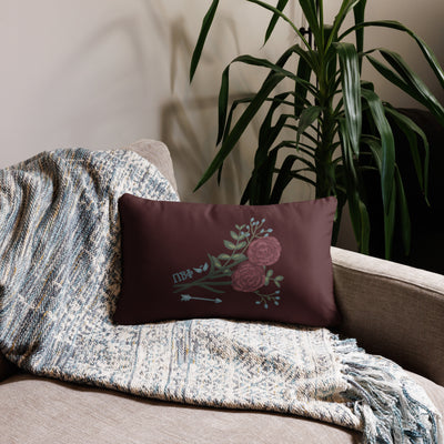 Pi Beta Phi wine carnation design pillow in 20" x 12" lumbar pillow size shown on couch