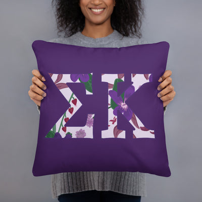 Sigma Kappa filled letters sorority pillow shown in 18" x 18" size in model's hands