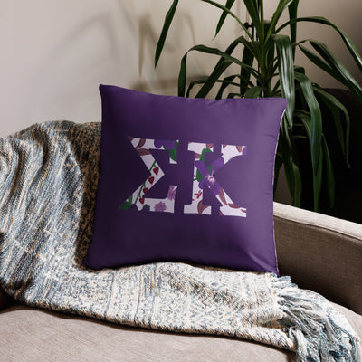 Sigma Kappa filled letters sorority pillow shown in 22" x 22" size shown on couch