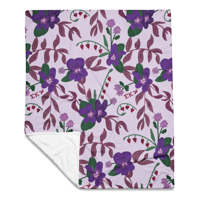Sigma Kappa Floral Print Throw Blanket in lavender showing solid white reverse side