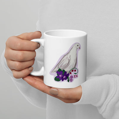Sigma Kappa Mom Mug in 11 oz size in model's hands showing dove mascot on back