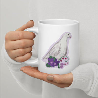 Sigma Kappa Mom 20 oz Mug showing dove design on white mug in model's hands