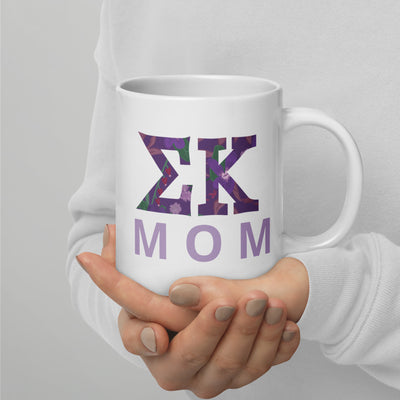 Sigma Kappa Mom 20 oz Mug showing filled letters on white mug in model's hands