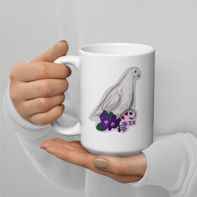 Sigma Kappa Mom Mug in 15 oz size in model's hands showing dove mascot on back