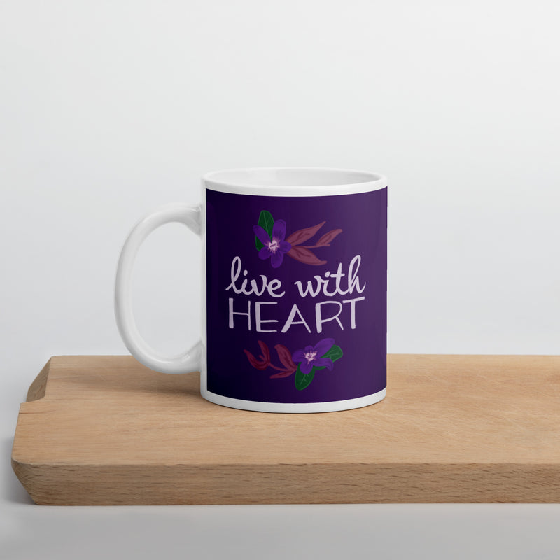 Sigma Kappa Live with Heart Motto Mug in 11 oz size in violet shown on wooden cutting board