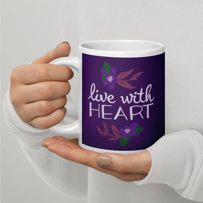 Sigma Kappa Live with Heart Motto Mug in violet shown in 20 oz size in model's hands with handle on left