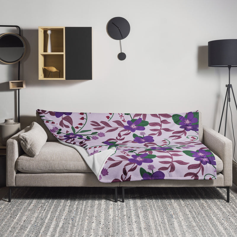 Sigma Kappa Floral Print Throw Blanket in lavender shown in 60" x 80" size shown on couch