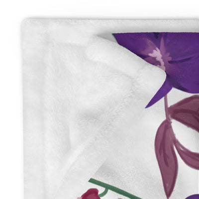 Sigma Kappa Violet Floral Print Blanket in white with violet floral print showing solid white reverse side