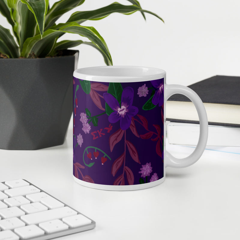 Sigma Kappa violet floral print mug shown in violet in office setting in 11 oz size