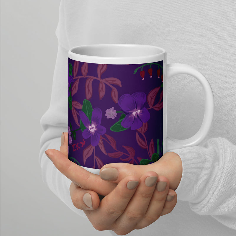 Sigma Kappa violet floral print mug shown in violet in 20 oz size in model&